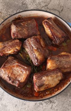 some meat is cooking in a pot on the counter top and it's ready to be eaten