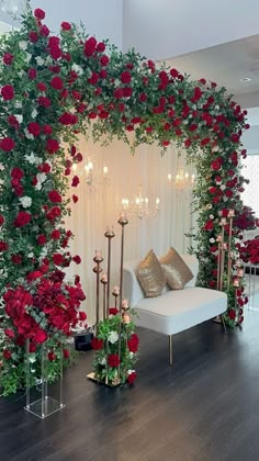 a room decorated with flowers and candles