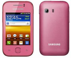 a pink samsung smart phone is next to the camera