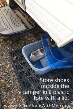 two plastic containers with shoes in them sitting on the ground