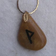 Rune Of Joy Necklace Is Great For Women Or Men. This Is A Handmade Pendant On A Goldtone 24 Inch Chain. Pendant Is A Polished Piece Of Brown/Ochre Colored African Jasper. It Has The Rune Of Joy, Wynn, Hand Painted On It In Black. Goldtone Leaf Bail. Pendant Is A Little Over 1 1/4 Inches High, And Not Quite 1 Inch Wide. Great For Any Occasion. Bring The Power Of Wynn Into Your Life. Joy Necklace, Rune Necklace, Interlocking Circle Necklace, Sterling Silver Choker Necklace, Pearl Lariat Necklace, Turquoise Statement Necklace, Tiered Necklace, Sterling Silver Choker, Silver Choker Necklace