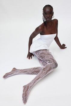 Sheer lace tights with an allover floral pattern for a femme finish. Features Ella lace tights Sheer tights Allover lace pattern Comfy waistband Content + Care 92% Nylon, 8% spandex Hand wash Imported Size + Fit S/M 4'10" -5'6" 90-130lbs L/XL 5'7" -5'6" 130-200lbs | Ella Lace Tights in Pink, Women's at Urban Outfitters Pink Tights Aesthetic, Lace Leggings Outfit, Coquette Tights, Pink Tights Outfit, Unique Tights, Lace Tights Outfit, Black Lace Tights, Tights Pattern, Bday Dresses