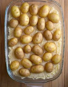 potatoes in a casserole dish on a wooden table