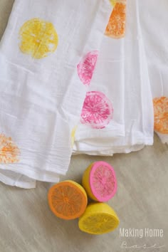 three pieces of fruit are sitting next to each other on a table with the words citrus stamping