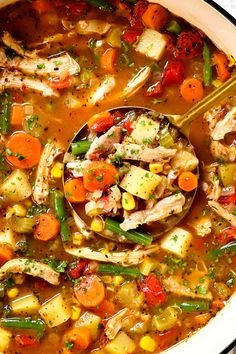 a bowl filled with chicken and vegetable soup