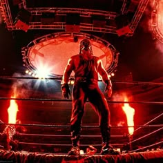 a wrestler standing in the middle of a ring