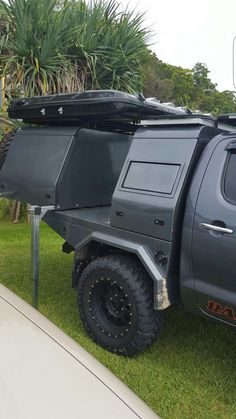 an off road vehicle parked in the grass