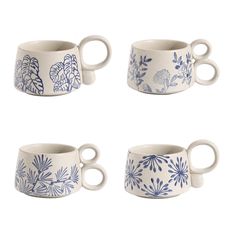 four blue and white mugs sitting next to each other