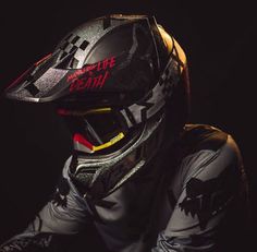 a person wearing a motorcycle helmet and protective gear