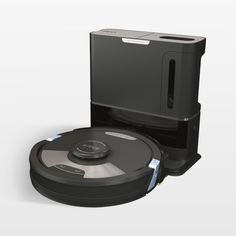 a robotic vacuum is shown with the lid open