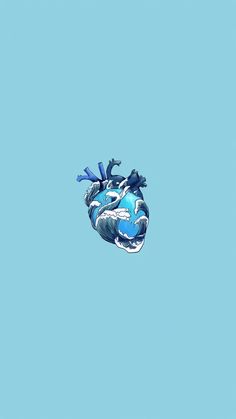 a blue heart shaped object floating in the air with two birds perched on top of it