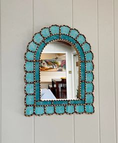 a mirror that is hanging on the wall