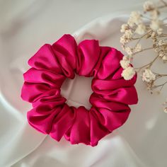 Add a touch of elegance to your hair routine with our Fuchsia Satin Hair Scrunchie. Crafted from high-quality satin, this scrunchie is not only a stunning accessory but also gentle on your hair, reducing breakage and preventing tangles. The vibrant hot pink color adds a pop of color to any outfit, making it a perfect addition to your hair accessory collection. Features: * Material: Luxurious satin * Color: Fuchsia * Size: Large, ideal for all hair types * Handmade: Carefully crafted with attenti Hot Pink Scrunchie, Scrunchies Business, Handmade Scrunchie, Hair Damage, Hair Accessories Collection, Hot Pink Color, Elegant Hair, Hair Routine, Color Fuchsia