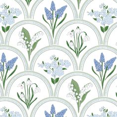 blue and white flowers are on a circular design pattern, with green stems in the center