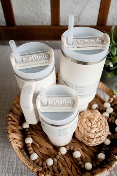 three mugs sitting on top of a wicker basket