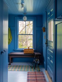 a room with blue walls and a bench