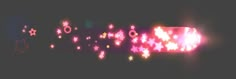 a blurry photo of some lights in the dark with stars and circles on them