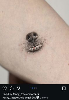 a dog's face is shown on the back of a woman's arm