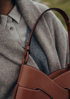 The “Nodde Hobo,” whose name echoes the French word for “knot,” is made up of two perfectly symmetrical, intertwined leather modules. Its beveled design accentuates its dynamic design and its base, set into the main body of the bag using a distinctive assembly technique. Polene Bag, Cognac Bag, Micro Bags, Winter Bags, French Word, Card Holder Purse, Upcycled Leather, Stylish Celebrities, Best Wallet