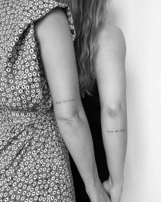 the back of two women's arms with small tattoos on them