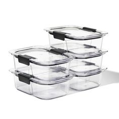 set of four glass storage containers with black lids