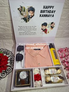 an open birthday gift box with items inside