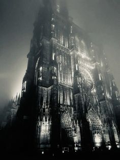 a very tall cathedral lit up at night