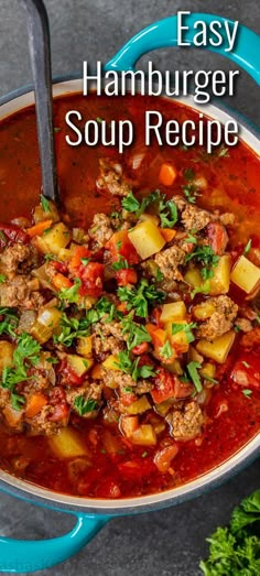 easy hamburger soup recipe in a blue bowl with a spoon and parsley on the side