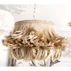 a chandelier with feathers hanging from it