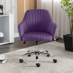 a purple office chair sitting on top of a carpeted floor next to a potted plant