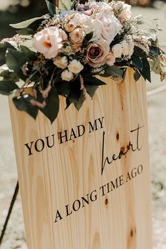 a wooden sign with flowers on it that says you had my heart at a long time ago