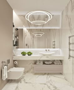 a bathroom with marble walls and flooring is shown in this image, there are two sinks