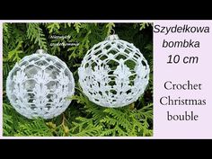 two crochet christmas ornaments hanging from a tree branch with the words,'s2