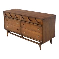 a wooden dresser with four drawers and brass handles