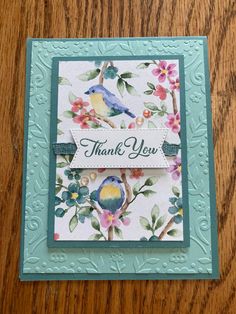 a thank you card with flowers and birds on it