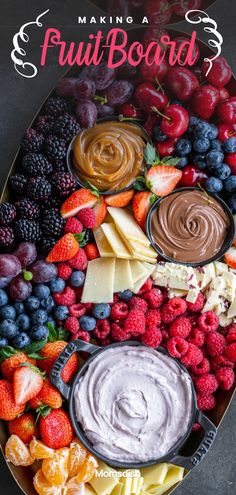 a platter filled with fruit and dips