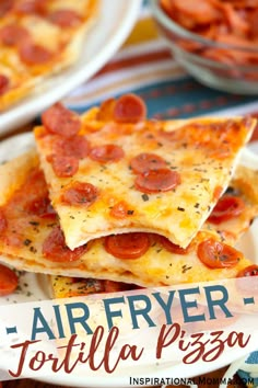 three slices of pizza on a plate with the words air fryer tortilla pizza