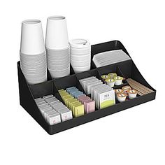 a black tray with cups and containers on it