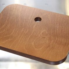 a wooden cutting board sitting on top of a table