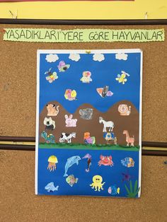 a bulletin board with pictures of animals on it and words written in green above them