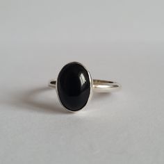 Handmade ring made from silver with black onyx stone Gemstone size: 1x1.5 cm Every piece is made by me from sterling silver (Ag 925) Classic Onyx Rings For Promise, Classic Onyx Open Ring Jewelry, Minimalist Onyx Rings For Formal Occasions, Minimalist Onyx Ring For Formal Occasions, Minimalist Onyx Gemstone Ring, Classic Onyx Promise Ring, Minimalist Onyx Signet Ring, Classic Black Sapphire Ring In Sterling Silver, Minimalist Black Enamel Open Ring