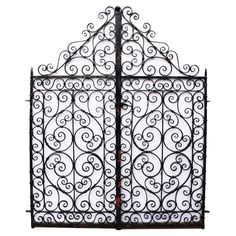 an ornate wrought iron gate on a white background