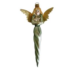 a glass angel ornament hanging on a white wall with an angel holding a baby in her arms