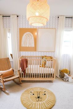 a baby's room with a lion rug and rocking chair