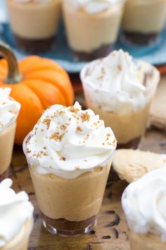 small desserts with whipped cream and pumpkins in the background