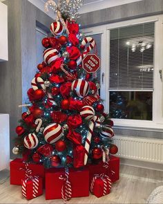 a christmas tree decorated with red and white ornaments