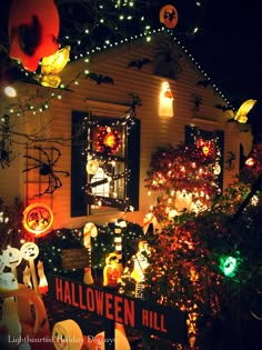 a house decorated with halloween decorations and lights