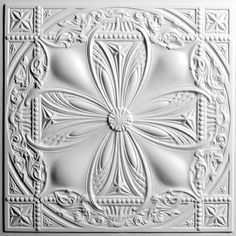 an intricately designed ceiling tile in white