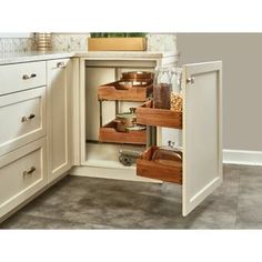 an open cabinet in a kitchen filled with food