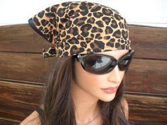 "NEW - Summer Fashion Headscarf Bandana Headband. Leopard print bandana headscarf - Women's headscarf - Summer fashion headband. Material: Leopard print bandana - 100 % Cotton Women / Teen size One size Size: Approximate - 60 \" inches long including straps Approximate - 15 \" inches height Care instructions: Hand wash cold. Lay flat to dry. Air dry only." One Size Bandana With Bandana Print For Beach, Beach Bandana One Size Fits Most, Brown Bandana Print Bandana For Festivals, Brown Bandana With Bandana Print For Festival, Festival Brown Bandana With Bandana Print, Casual Brown Bandana One Size Fits Most, Black Bandana Print Headscarf For Summer, Trendy Bandana With Matching Headband, Casual Brown Adjustable Bandana